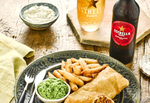 Estrella Damm Beer Battered Fish and Chips With Glass And Bottle.jpg